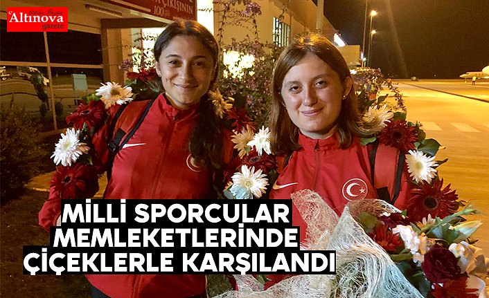 Milli sporcular memleketlerinde çiçeklerle karşılandı