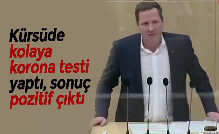 Kürsüde kolaya korona testi yaptı, sonuç pozitif çıktı