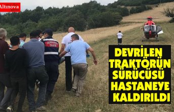 Devrilen traktörün sürücüsü ambulans helikopterle hastaneye götürüldü