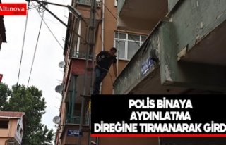 Polis binaya aydınlatma direğine tırmanarak girdi