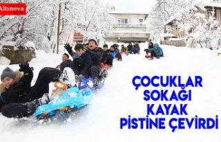 Çocuklar sokağı kayak pistine çevirdi